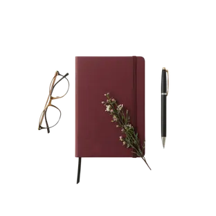 Imaine of a notebook, pen and glasses on a table
