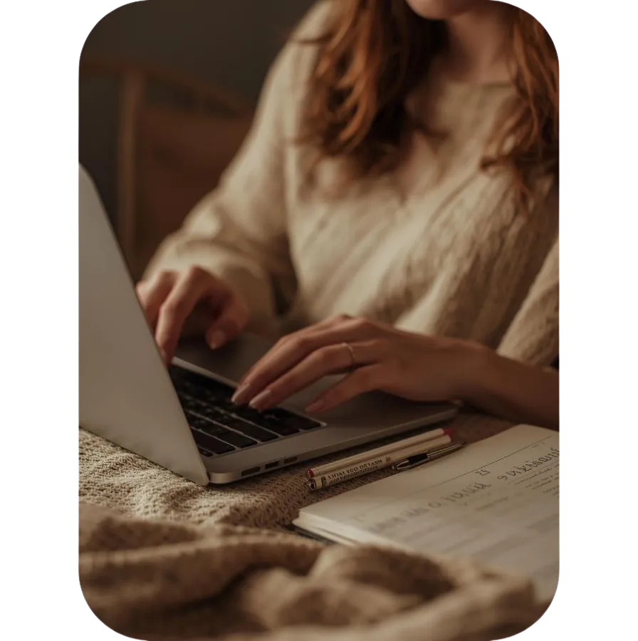 Woman typing at her laptop