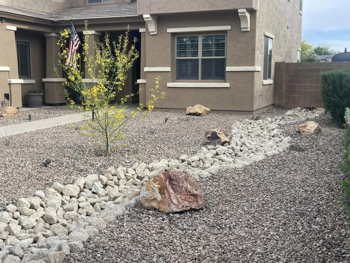 Artificial grass installation in a residential backyard, providing a low-maintenance, green outdoor space.