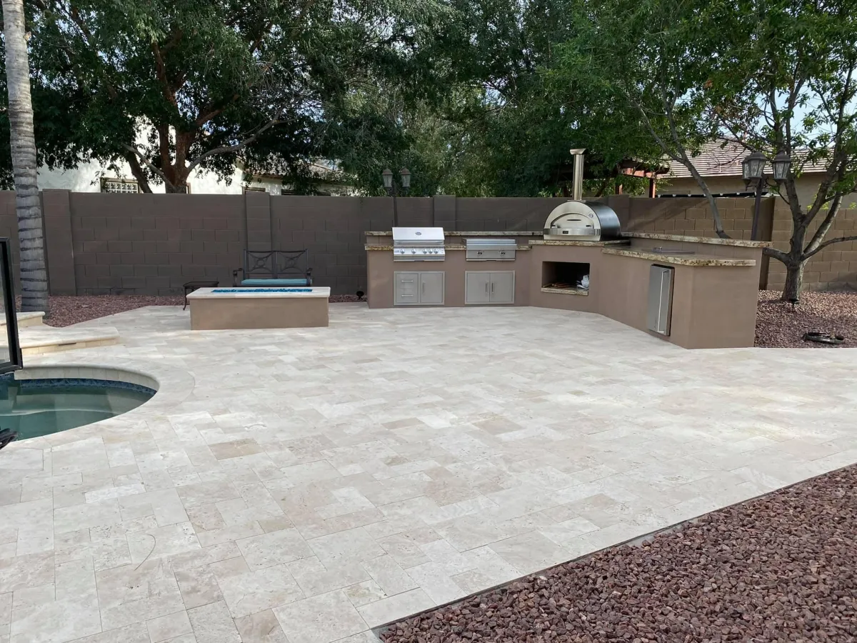 Artificial grass installation in a residential backyard, providing a low-maintenance, green outdoor space.