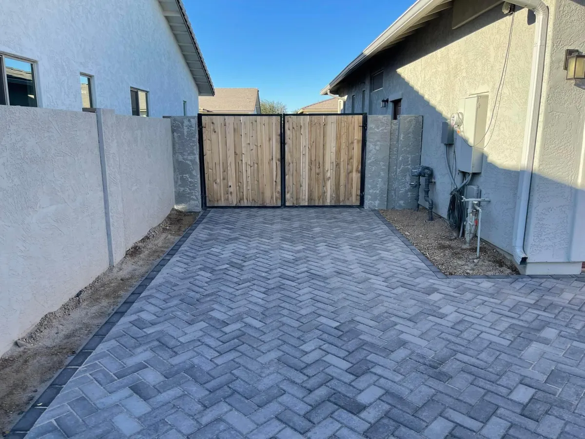 Custom paver walkway and driveway installation featuring a durable and weather-resistant design for enhanced curb appeal.