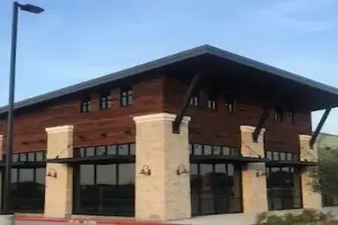 Modern retail office park building with completed commercial roofing by Maple Grove Commercial Roofing