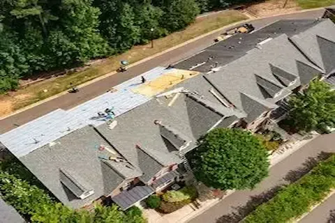 Aerial view of multi-family HOA roofing replacement underway by Maple Grove Commercial Roofing Co