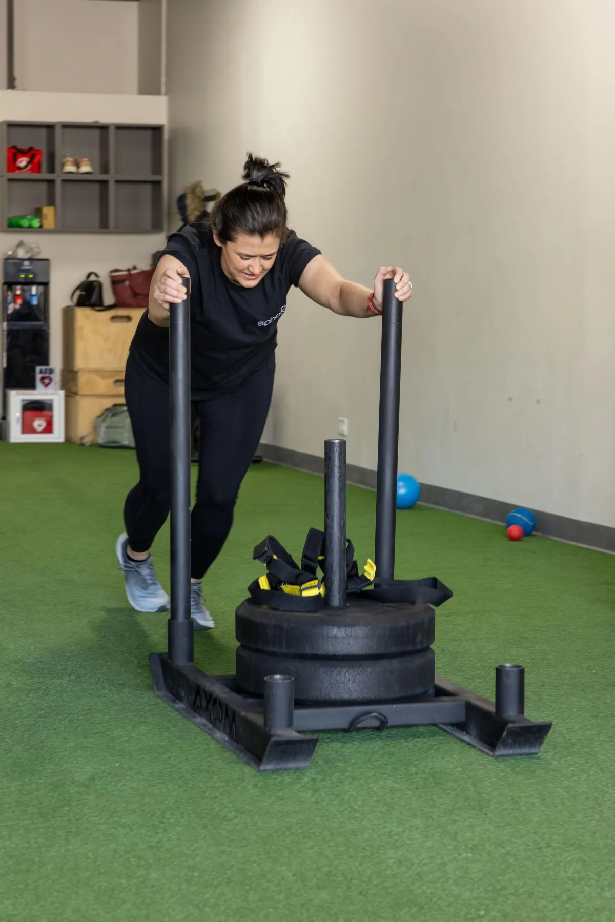 Woman pushing a sled