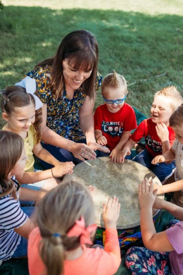 Samantha Foote playing music with children