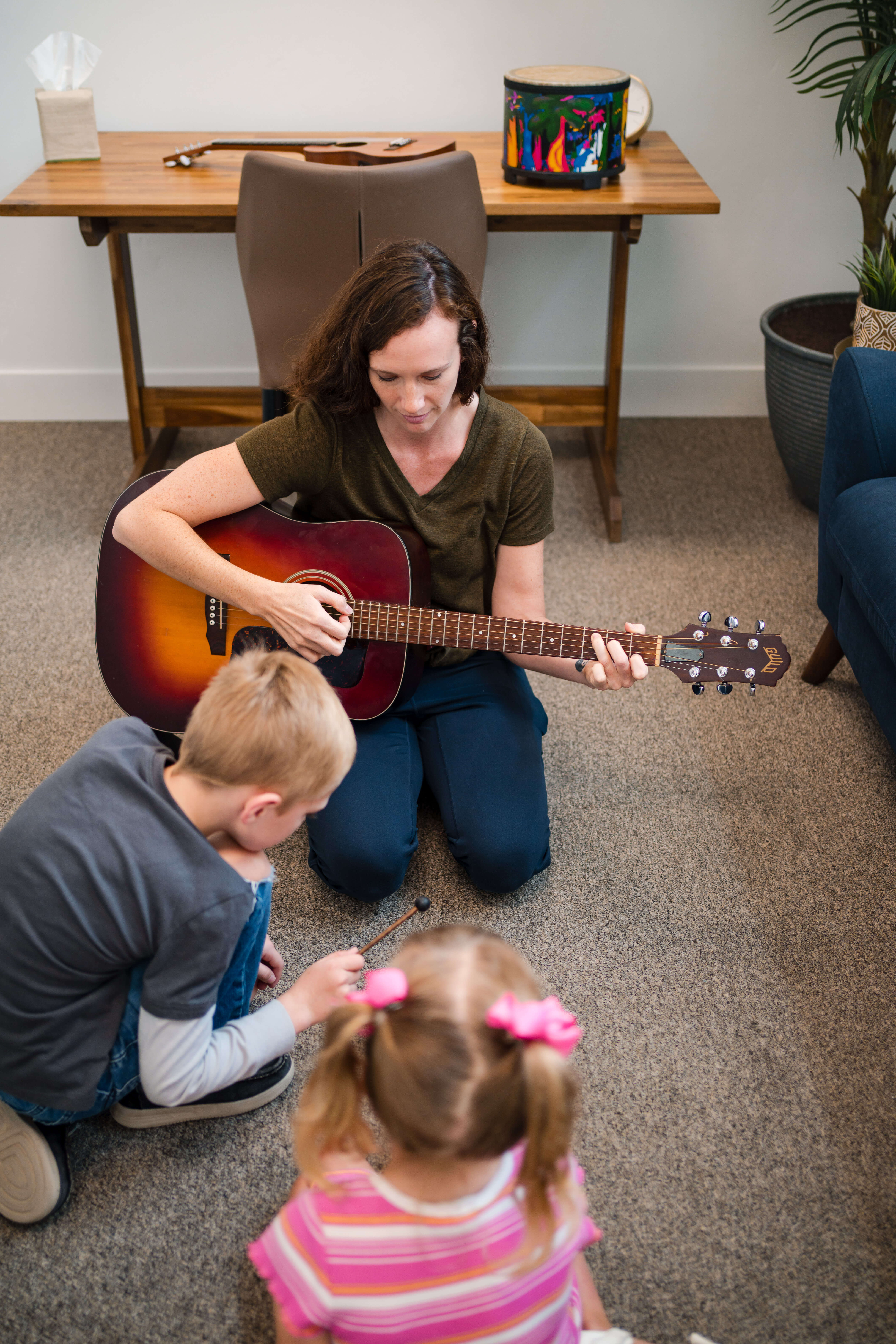 Samantha Foote playing music with children
