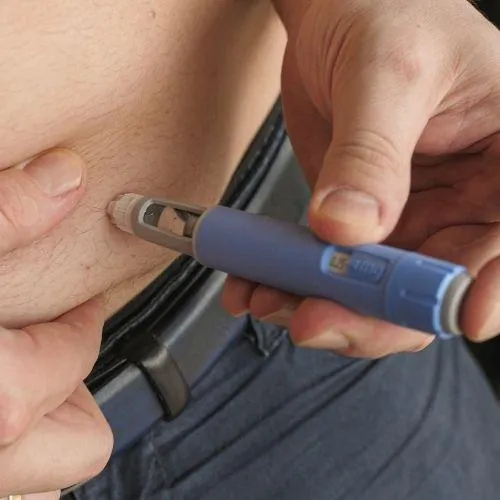 A person getting Semaglutide injection that helps with obesity.