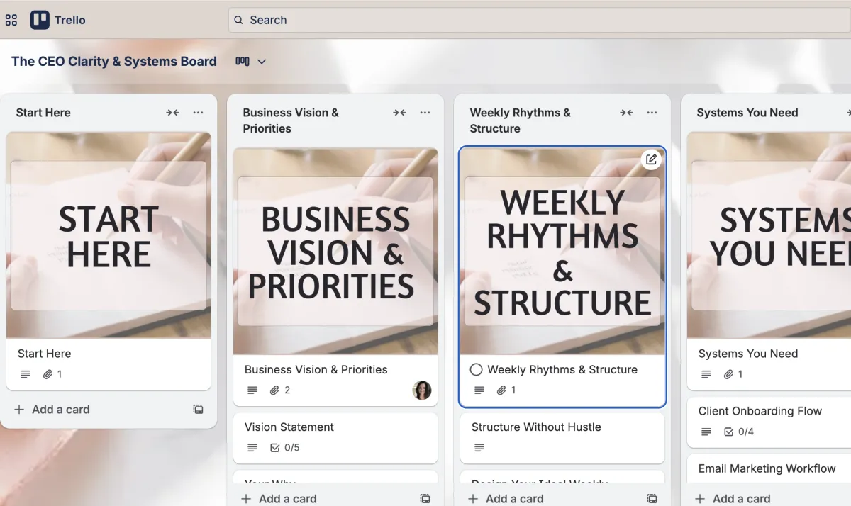 A smiling blonde woman in a white shirt indoors.