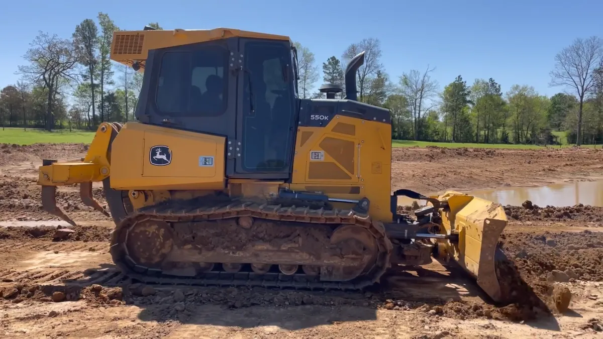 Our 115 HP bulldozer is a robust machine designed for heavy earthmoving tasks.