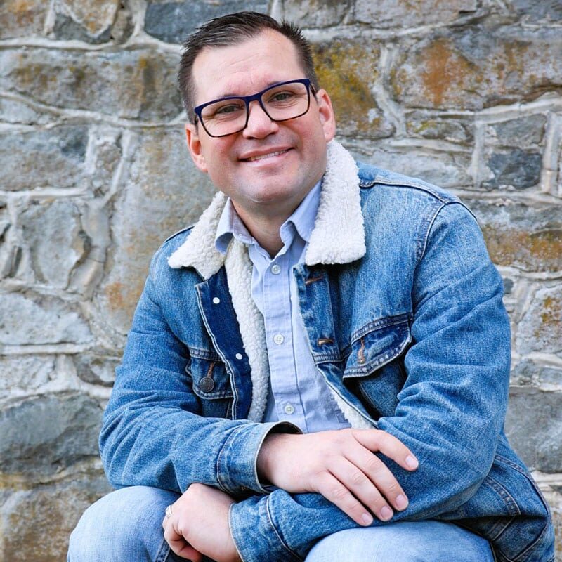 Modern living room with sofa, tv, and bookshelf