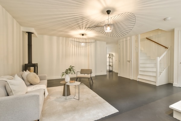 a kitchen with white cabinets and a stove top oven