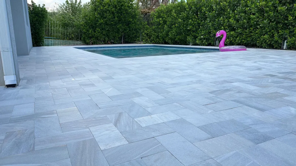 sealed-pool-deck-with-pink-flamingo-float