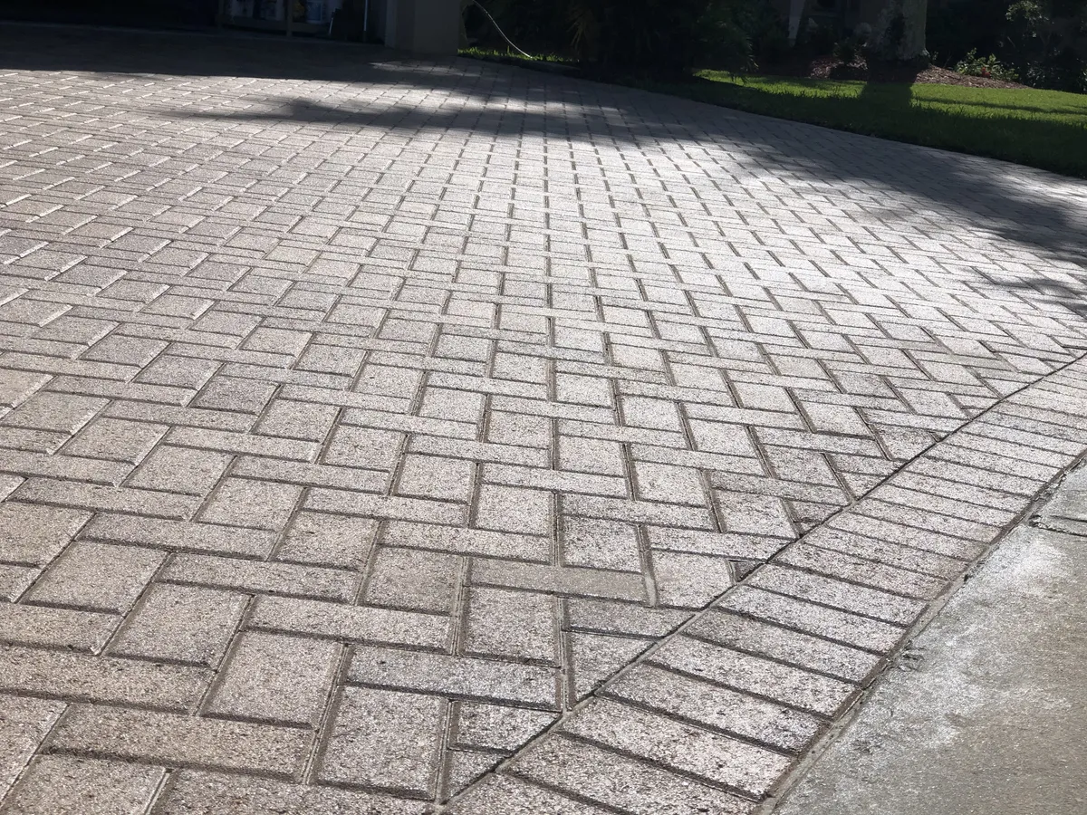 Concrete paver driveway before cleaning and restoration