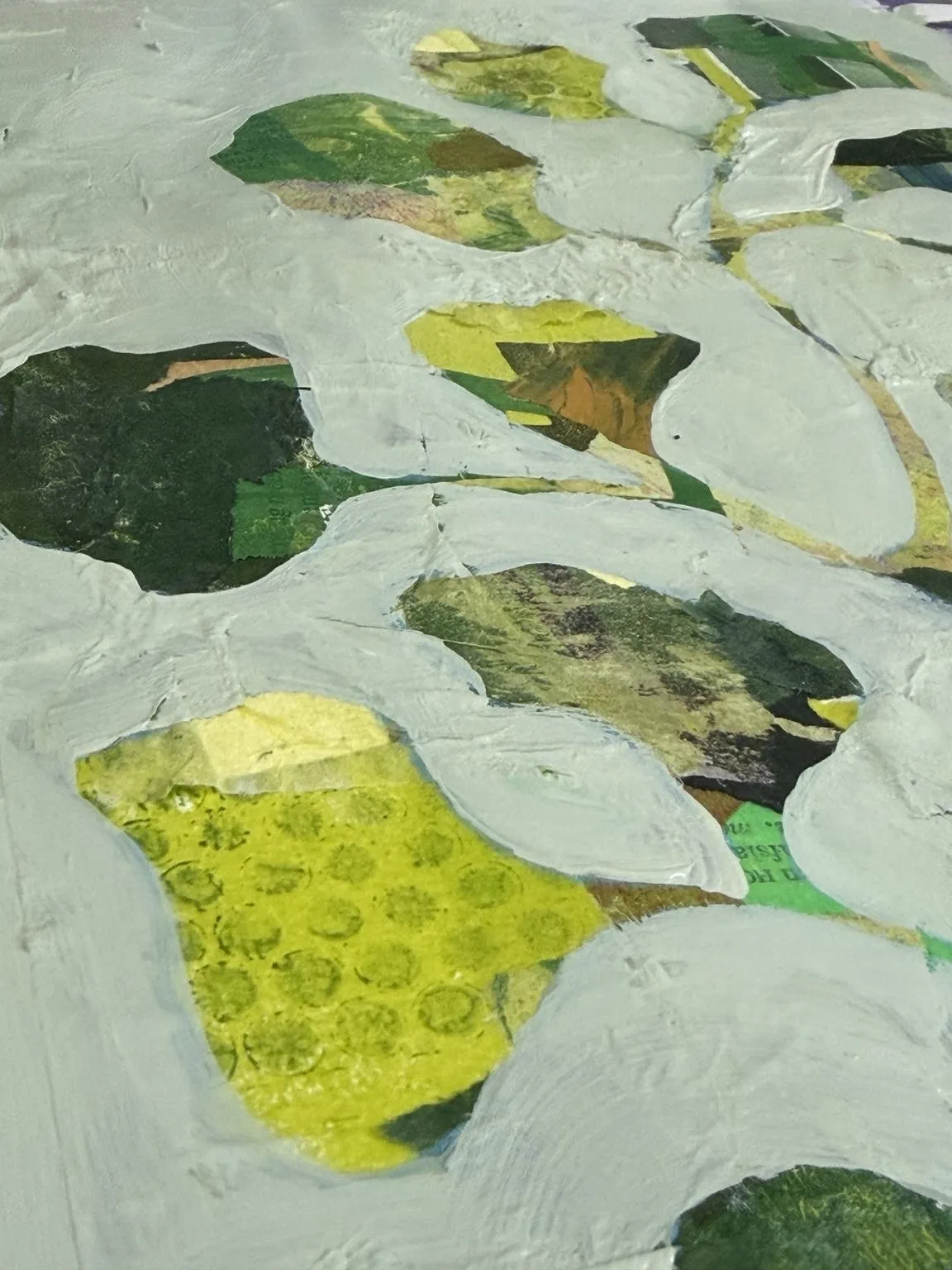 anna sitting on a tale filled with art supplies