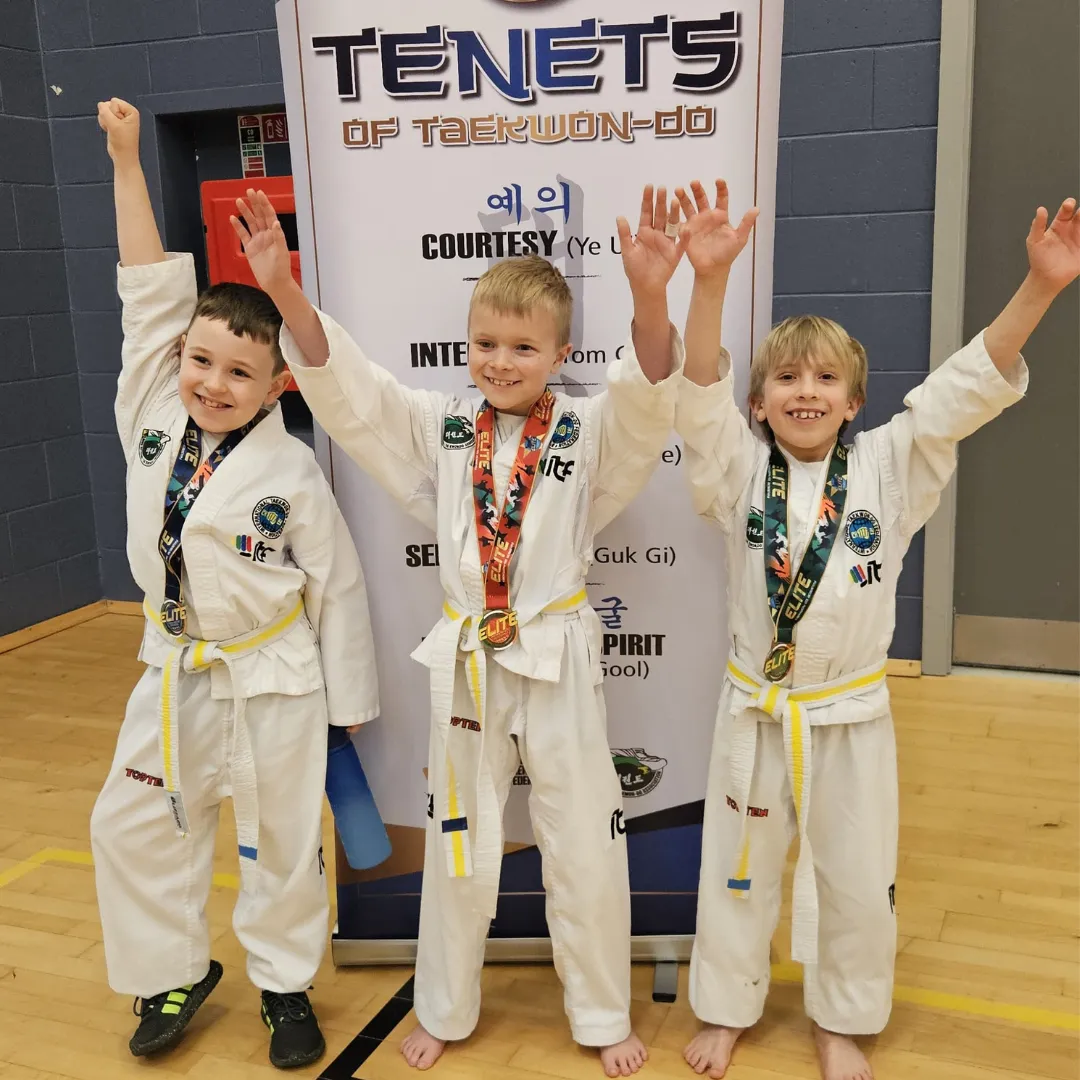 Students celebrating with medals