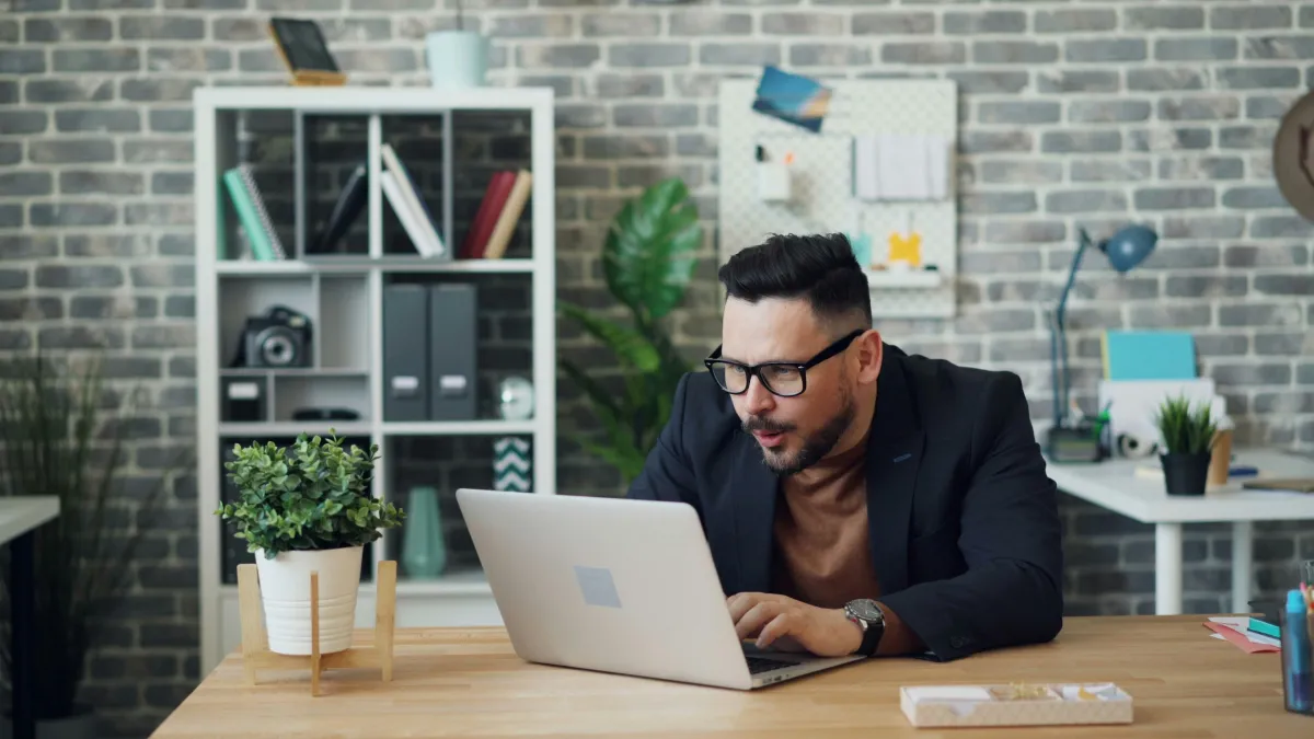 Young professional feeling stuck at desk, ready to build momentum