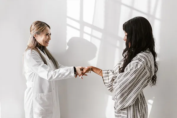Doctor referring to physical therapist