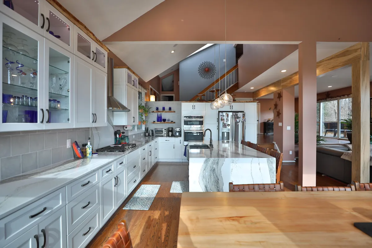 a kitchen with granite counter tops and stainless steel appliances