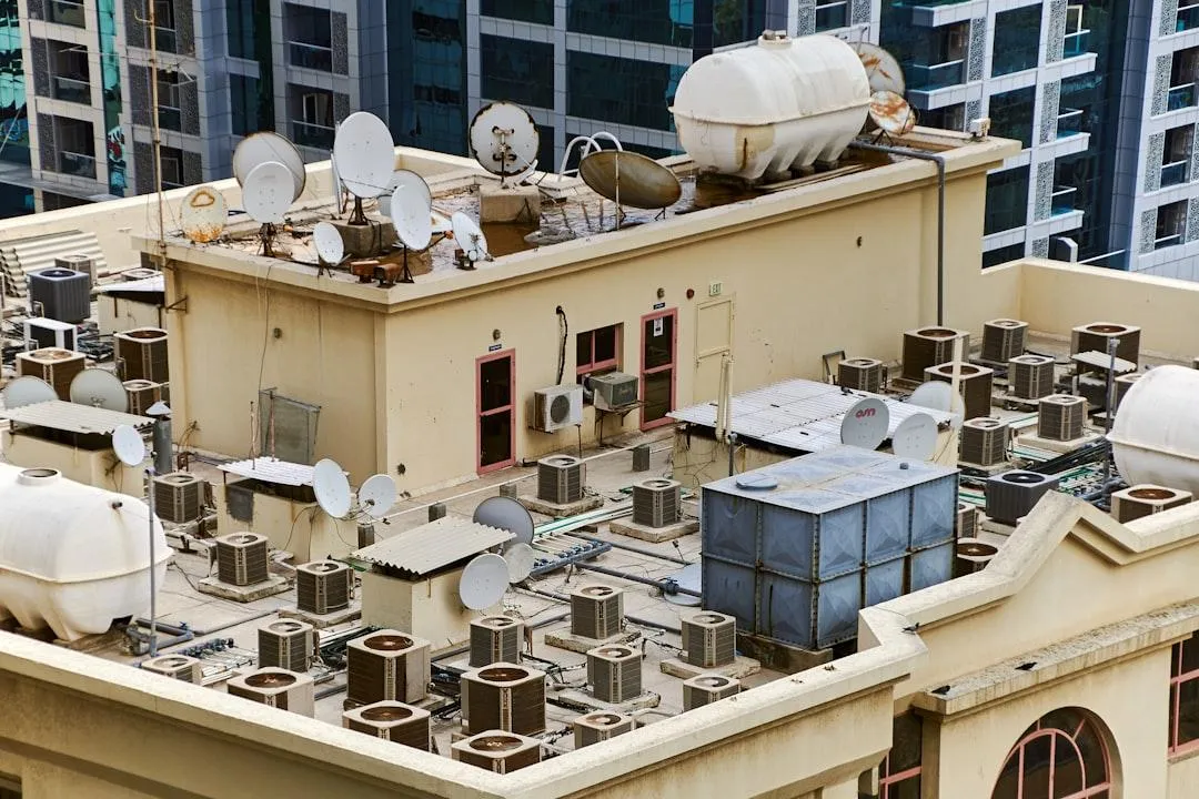 Modern commercial building rooftop with HVAC equipment and conduit infrastructure representing post-179D energy capital planning in 2026