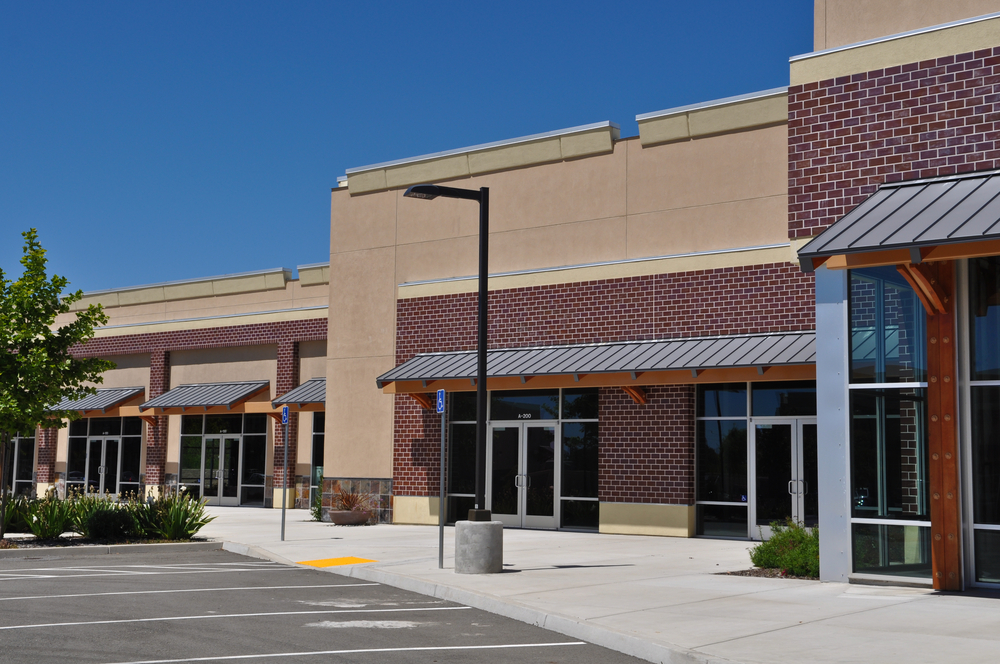 Strip center commercial property with open retail bays ideal for bridge financing during stabilization.