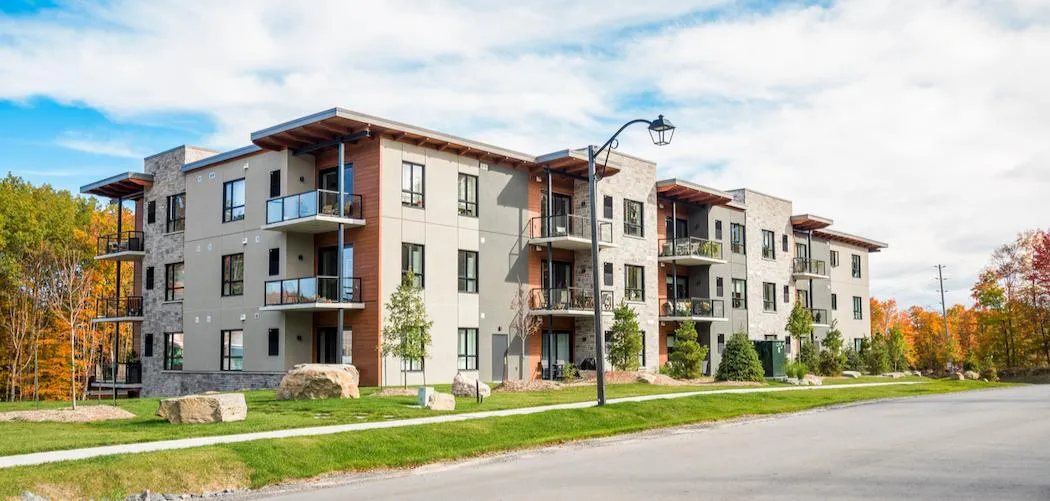 Modern South Florida condo with palm trees and private balconies, commonly financed through private condo inventory financing Miami.