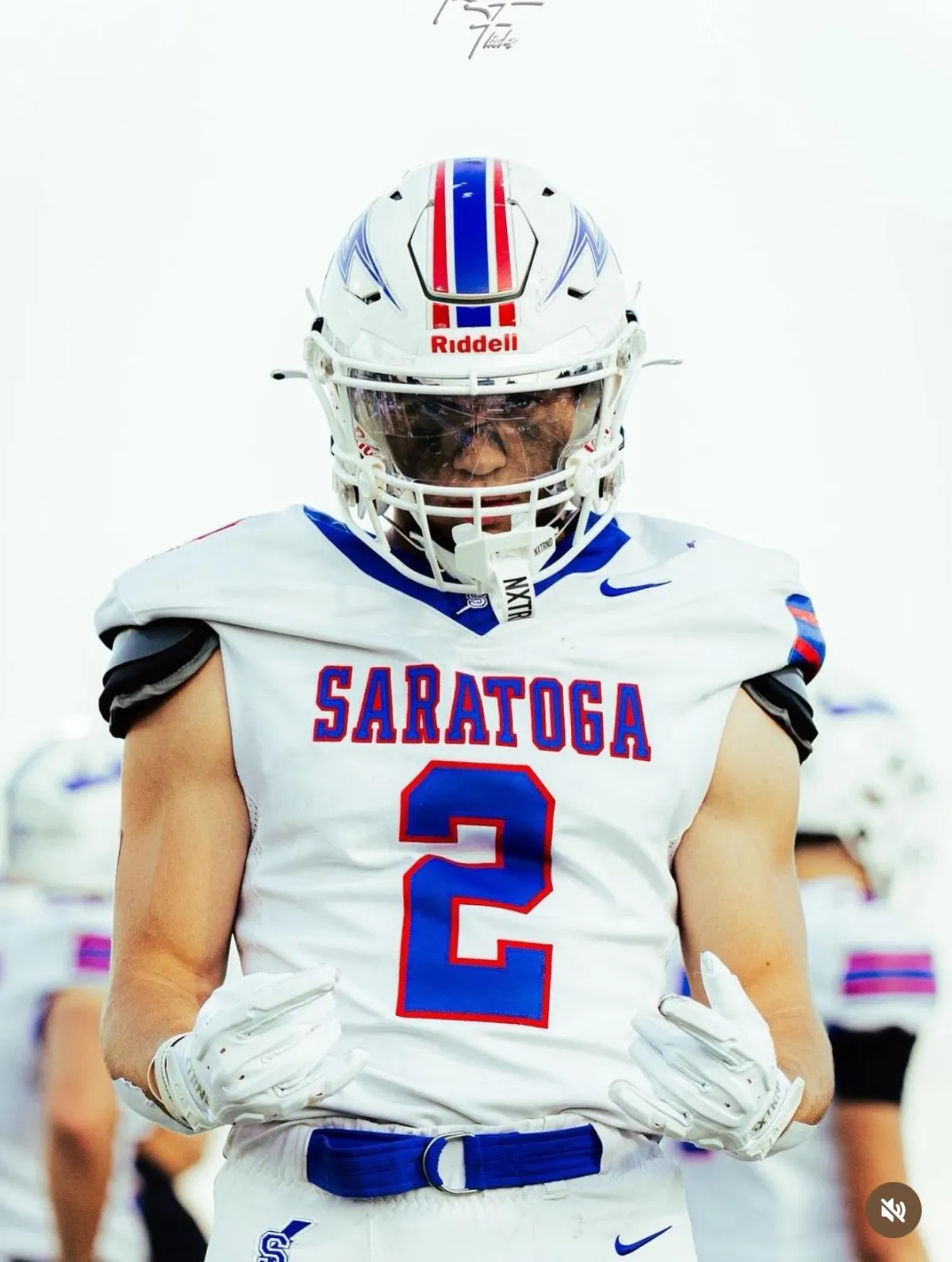 Close square portrait of Benjamin Coryea, 17, wearing his Blue Streaks jersey #2, three-quarter turn, confident smile, soft natural light, shallow depth of field, photorealistic style emphasizing clarity and recruiting-ready presentation.