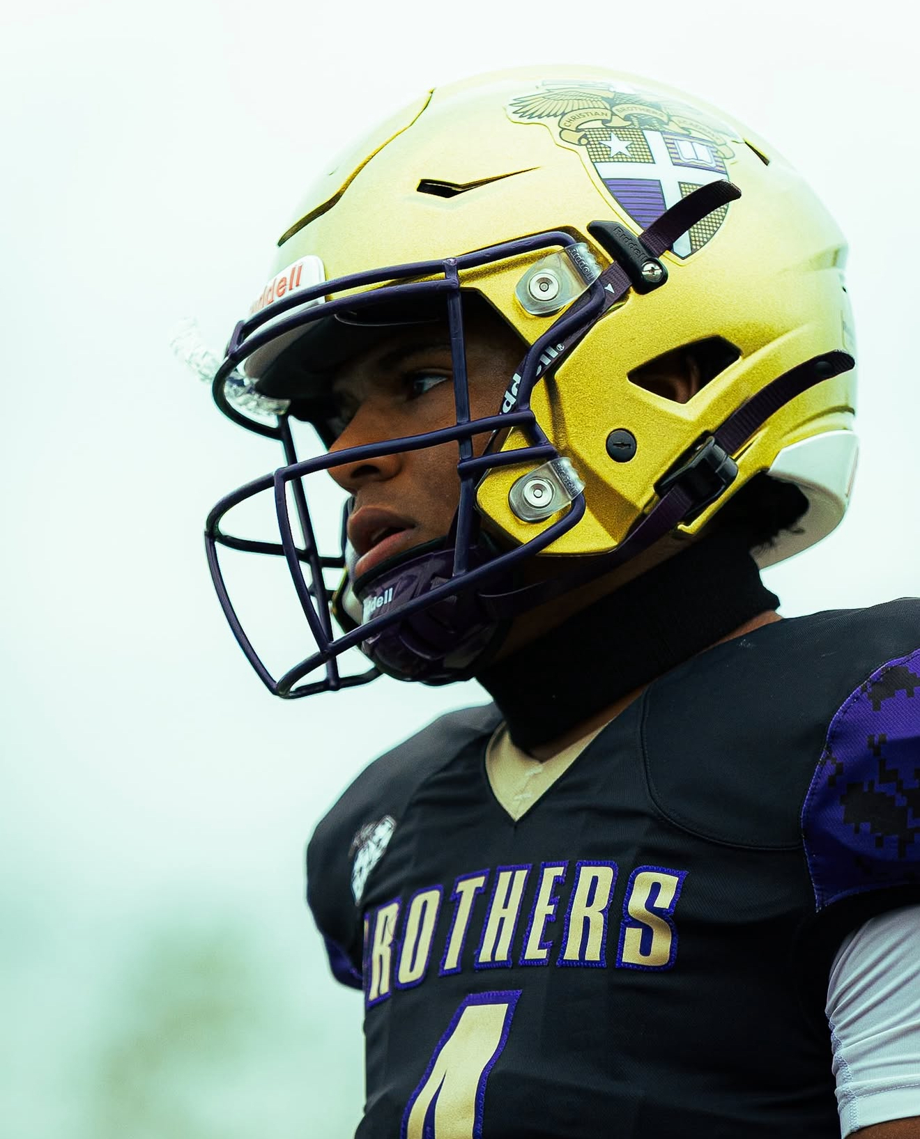Archie Jones, 6'1" quarterback in CBA navy practice jersey, confident three-quarter, waist-up portrait