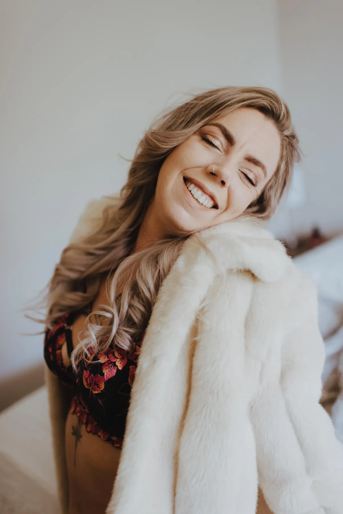 woman smiling during lingerie photoshoot