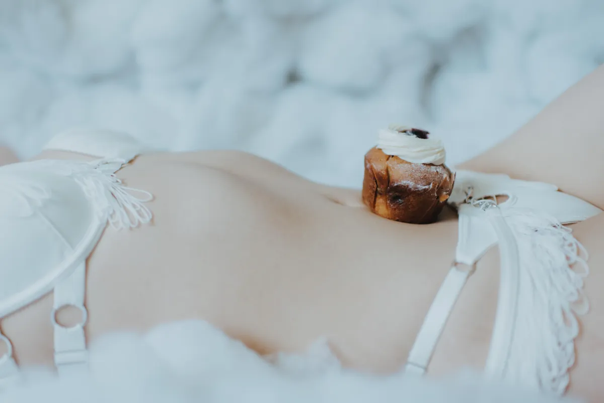 cupcake used as prop for boudoir photoshoot