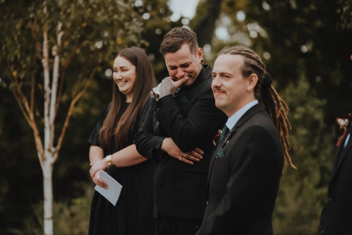 groom crying during bride walking up the aisle