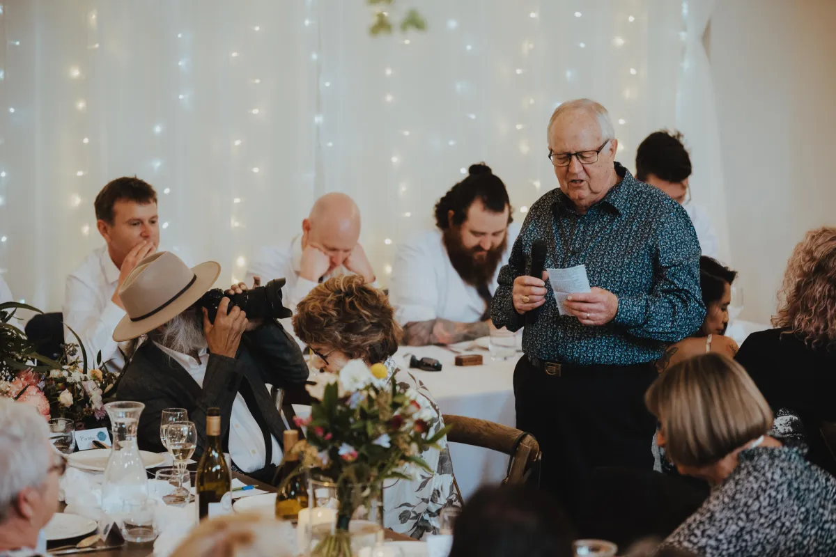 brides father photographing the grooms father at speeches