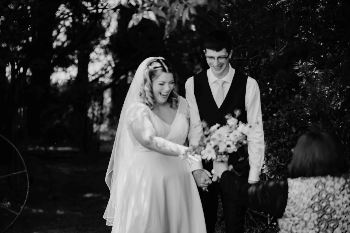 newlyweds exiting the ceremony at darjon vineyard