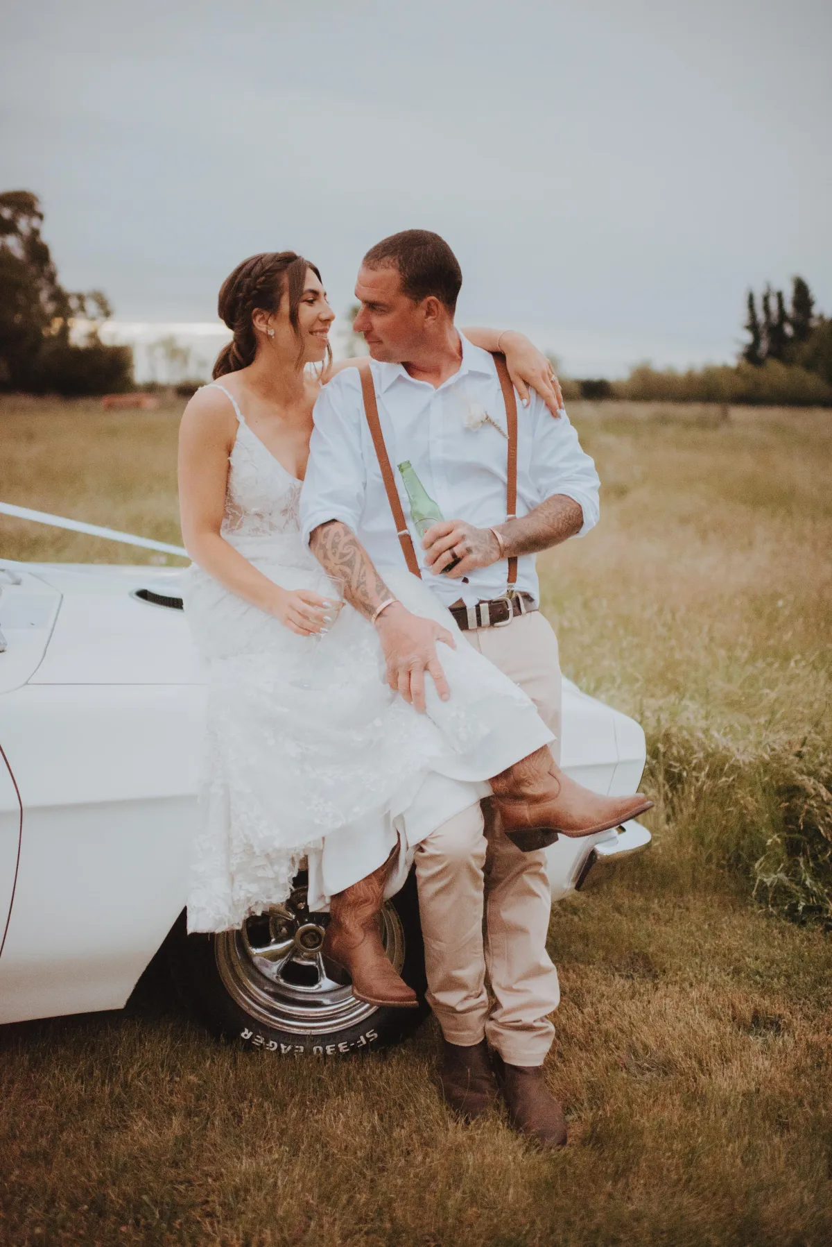 newlyweds taking a moment at sunset for photo