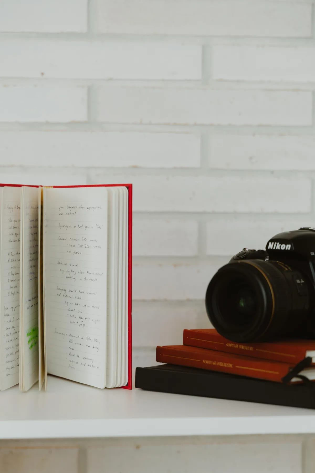 stack of learning resources and books with camera