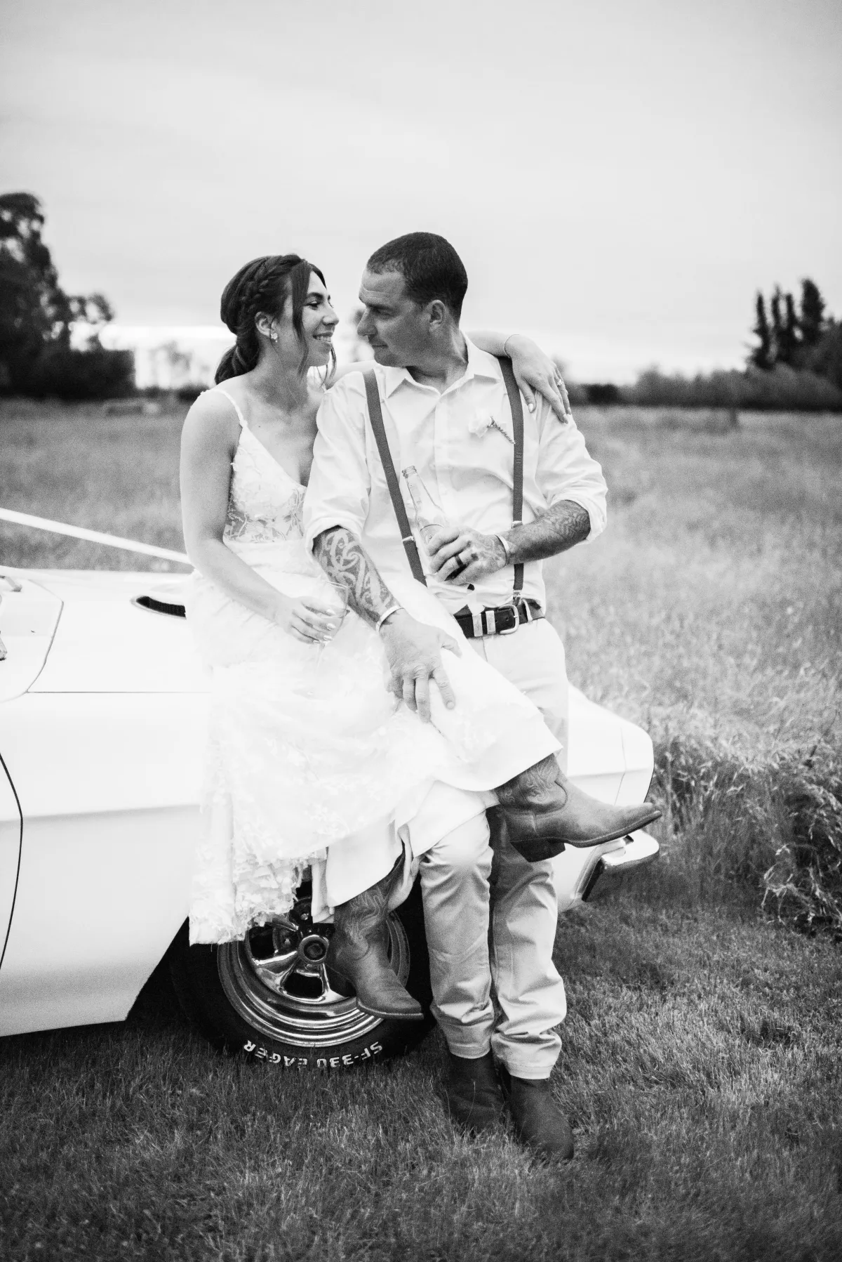 newlyweds taking a moment at sunset for photo