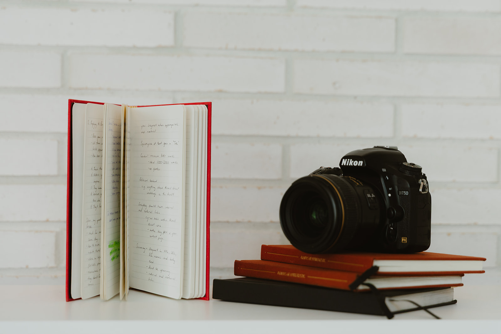 stack of learning resources and books with camera