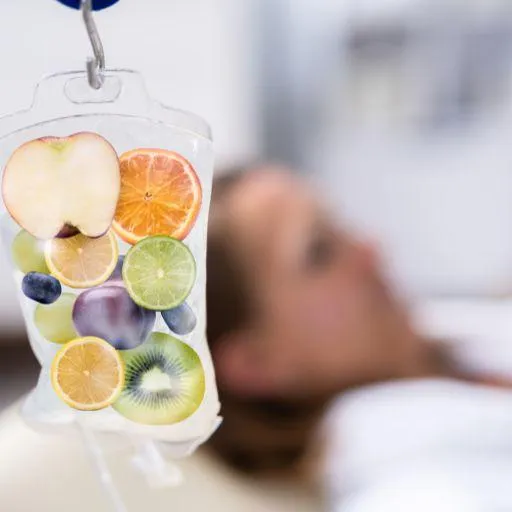 A person receiving vitamin IV therapy with a bag.