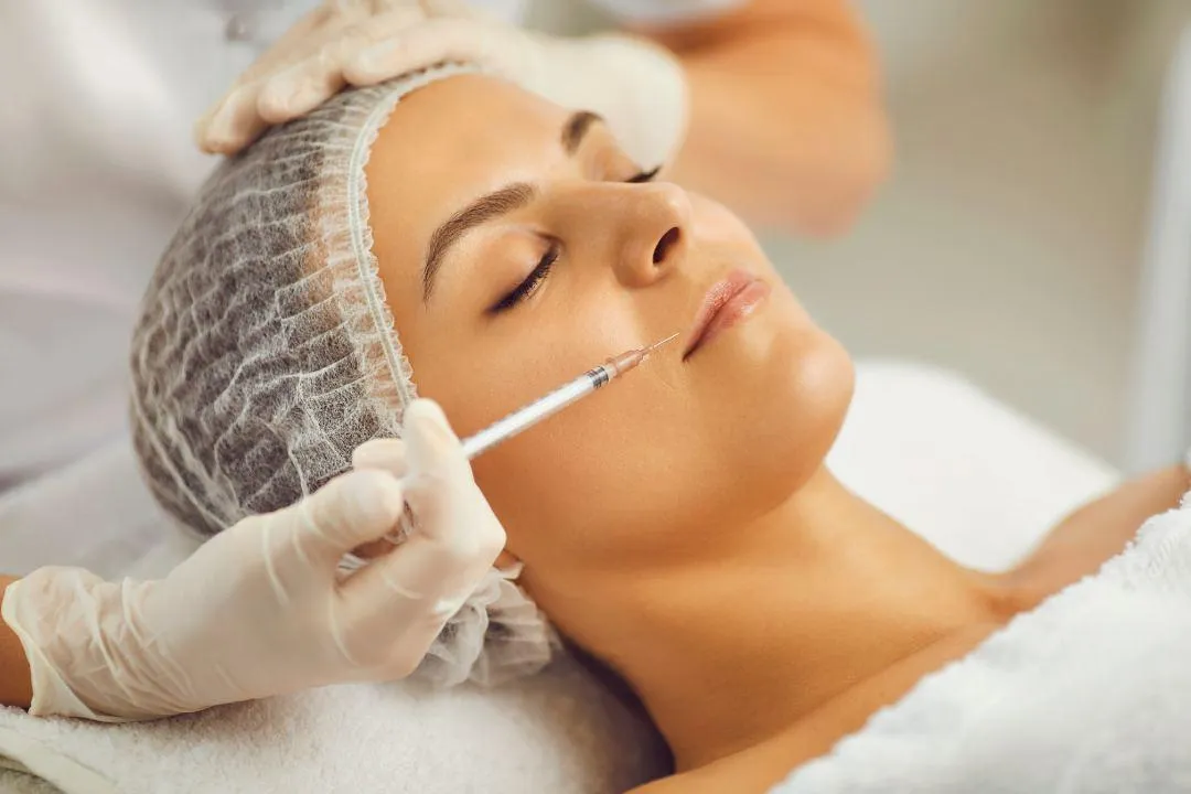 A licensed professional administering Botox injection to a patient during a safe and certified cosmetic procedure session.