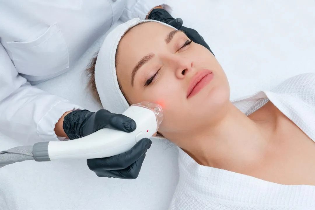 Woman receiving professional laser hair removal treatment on face in a spa clinic, showcasing smooth skin and relaxation benefits.