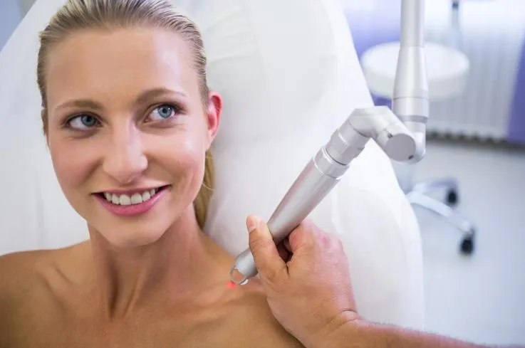 A woman undergoing a laser skin resurfacing treatment in Temecula to reduce fine lines, acne scars, and improve skin texture.