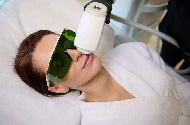 Patient receiving BBL skin treatment at LeVogue Med Spa in Temecula with protective goggles for eye safety.