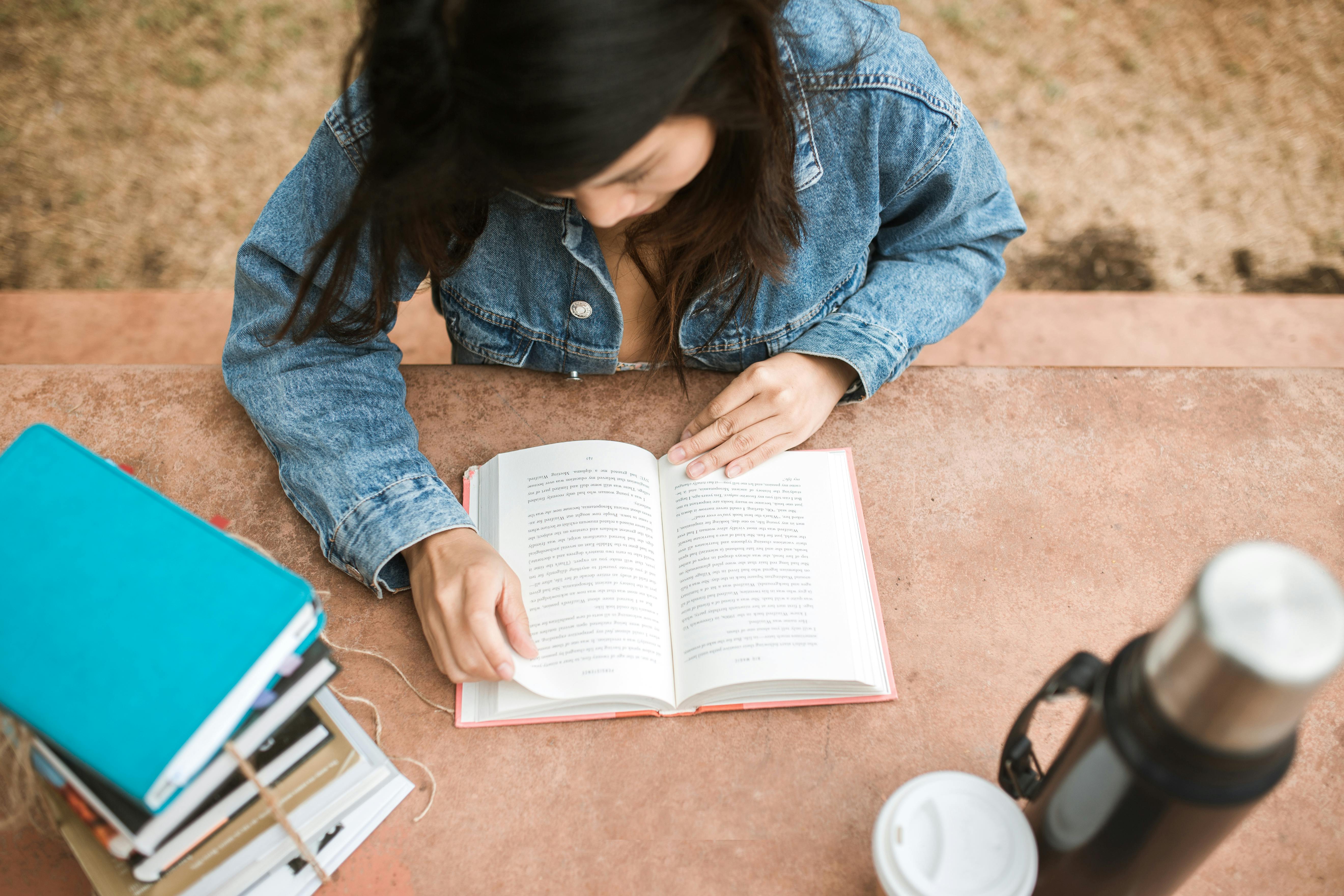 Girl reading at bench