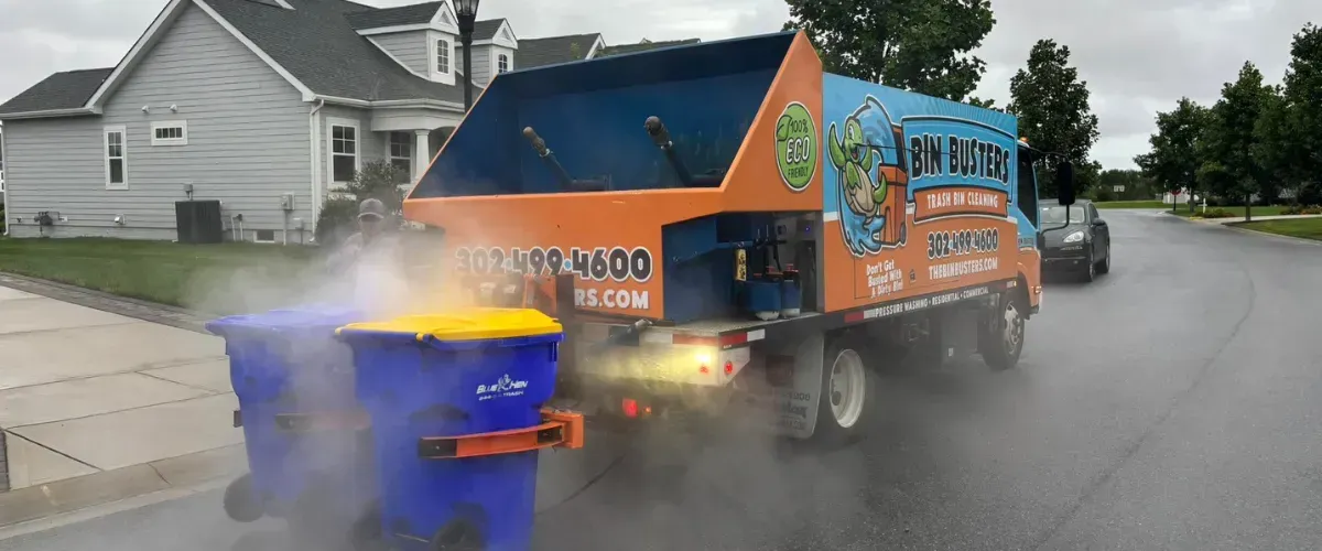 Steam-cleaning truck with 100% eco-friendly label from Bin Busters.