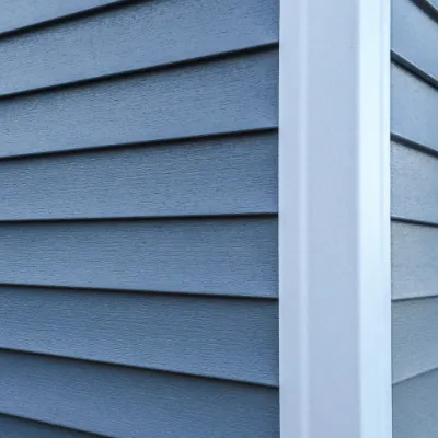 A derelict train sits on abandoned tracks.