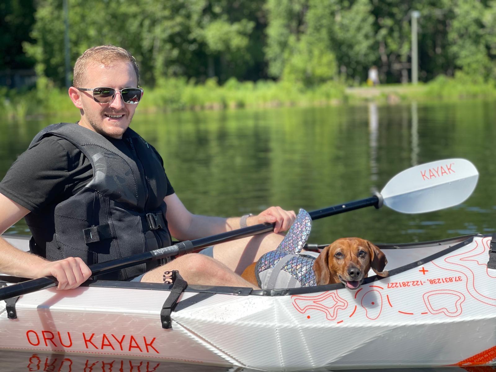 Brett kayaking with his dog.