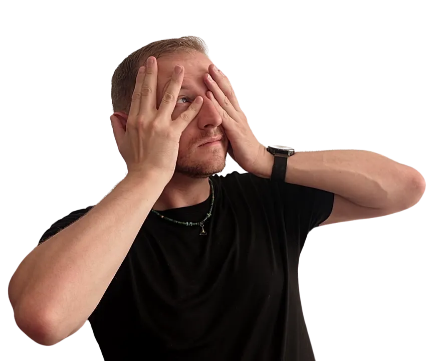 Brett covering his eyes and peeking out through his fingers