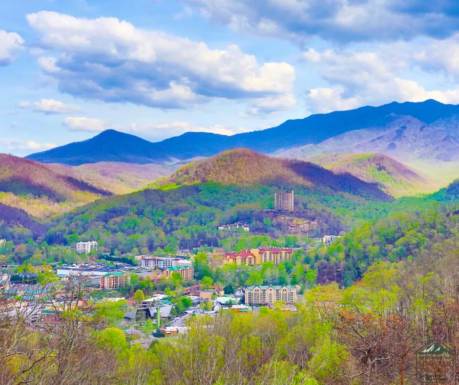 Panoramic view of Gatlinburg and the Smoky Mountains showcasing the natural beauty and local business community supported by Smoky Mountain Locally Owned.