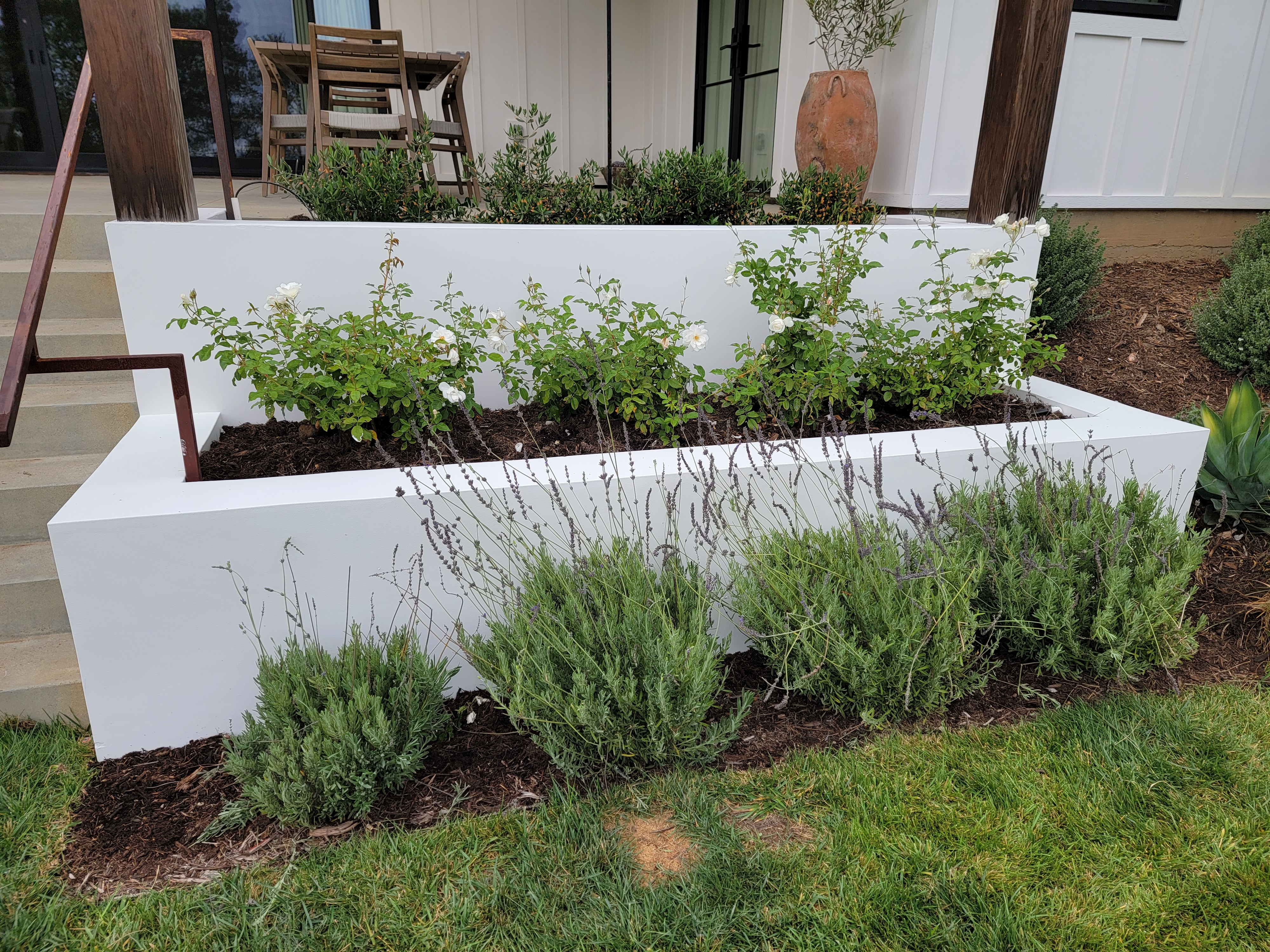 Concrete barrier painted with flowers and stars