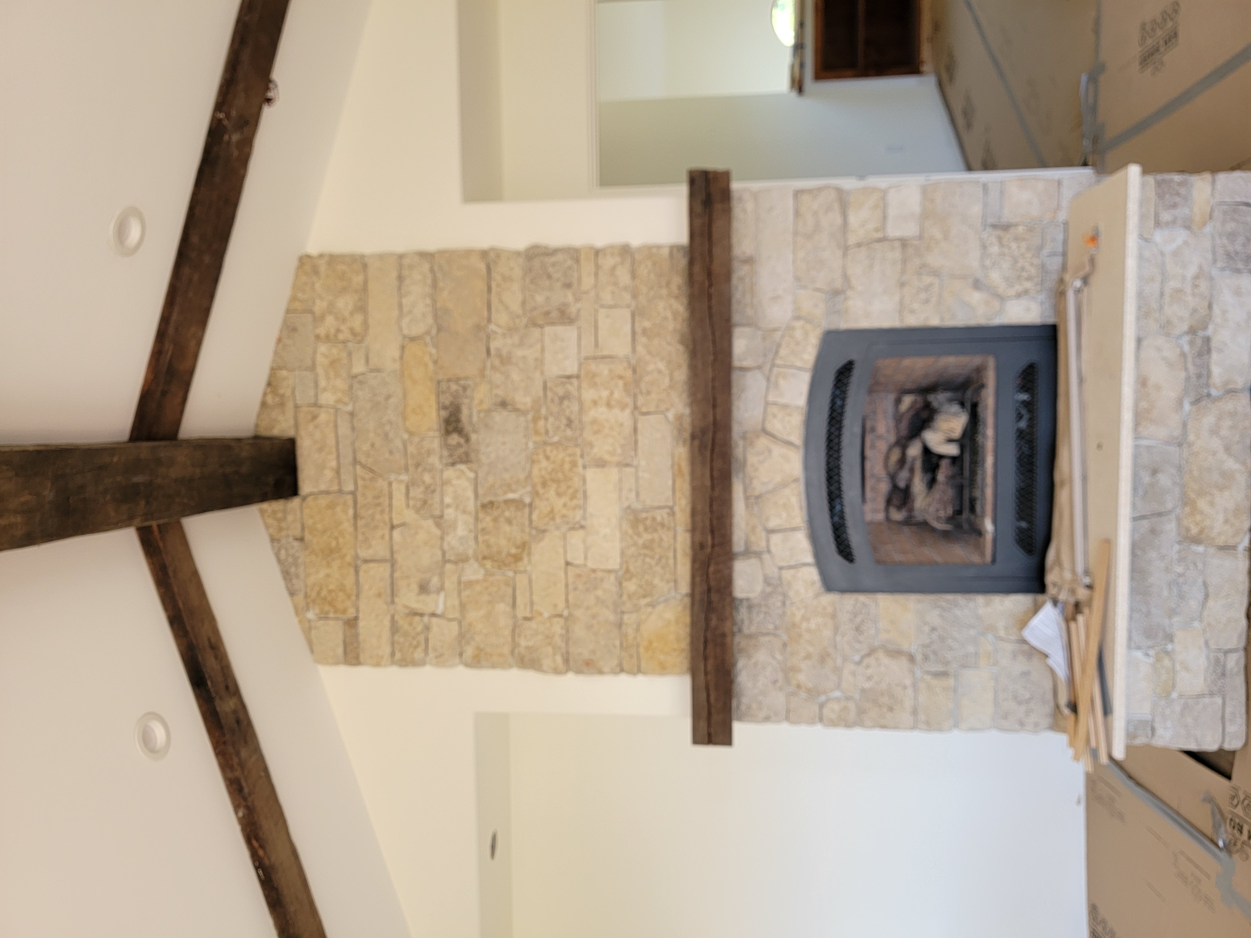 Young woman in dark room with teal lighting.