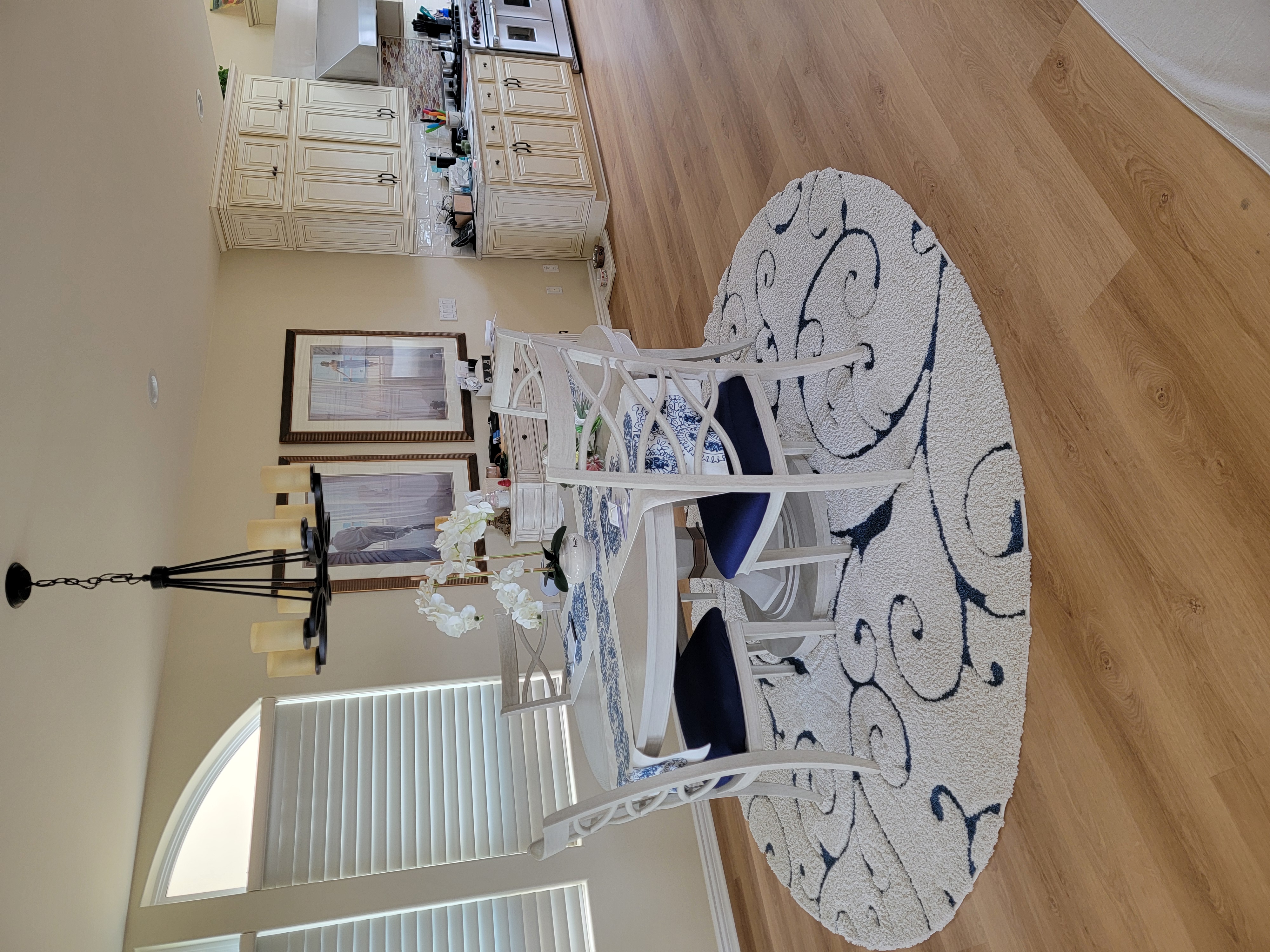 Young woman in dark room with teal lighting.